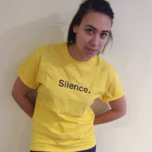 Model wearing yellow Silence. Tee Shirt